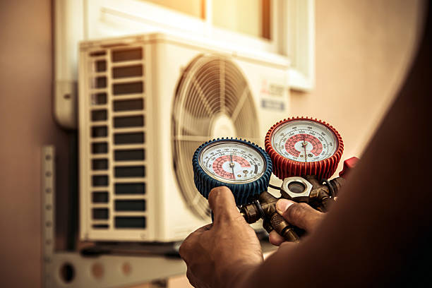 Professional Air Conditioning Service technician working in Rockford, AL